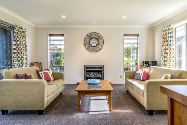 living-room-modern-apartment-with-two-identical-sofas-opposite-each-other_181624-14768